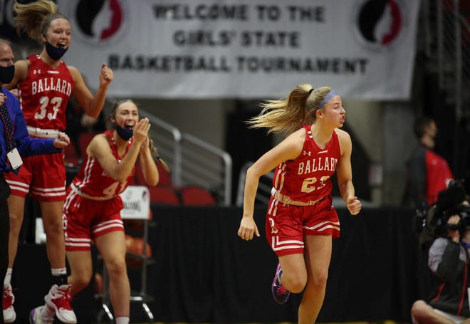 Members of the Ballard bench celebrate a late three-pointer by senior forward Josie Fleischmann, right, against Glenwood on Saturday, March 6, 2021, during the Iowa high school girls state basketball tournament Class 4A finals at Wells Fargo Arena in Des Moines.