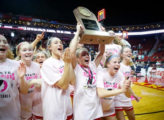 Members of the Ballard girls basketball team celebrate after beating Glenwood on Saturday, March 6, 2021, during the Iowa high school girls state basketball tournament Class 4A finals at Wells Fargo Arena in Des Moines.