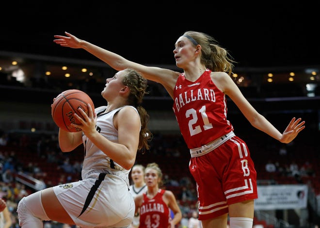 Ballard senior center Cassidy Thompson applies defense as Glenwood junior Coryl Matheny drives to the basket on Saturday, March 6, 2021, during the Iowa high school girls state basketball tournament Class 4A finals at Wells Fargo Arena in Des Moines.