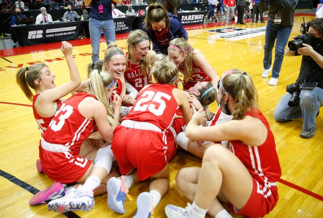 Members of the Ballard girls basketball team celebrate after beating Glenwood on Saturday, March 6, 2021, during the Iowa high school girls state basketball tournament Class 4A finals at Wells Fargo Arena in Des Moines.